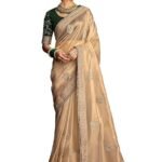 Shimmer Net Gold-coloured saree featuring an all-over heavy gold zari butta and sequence work on body decorated with border with contrast navy blue piping